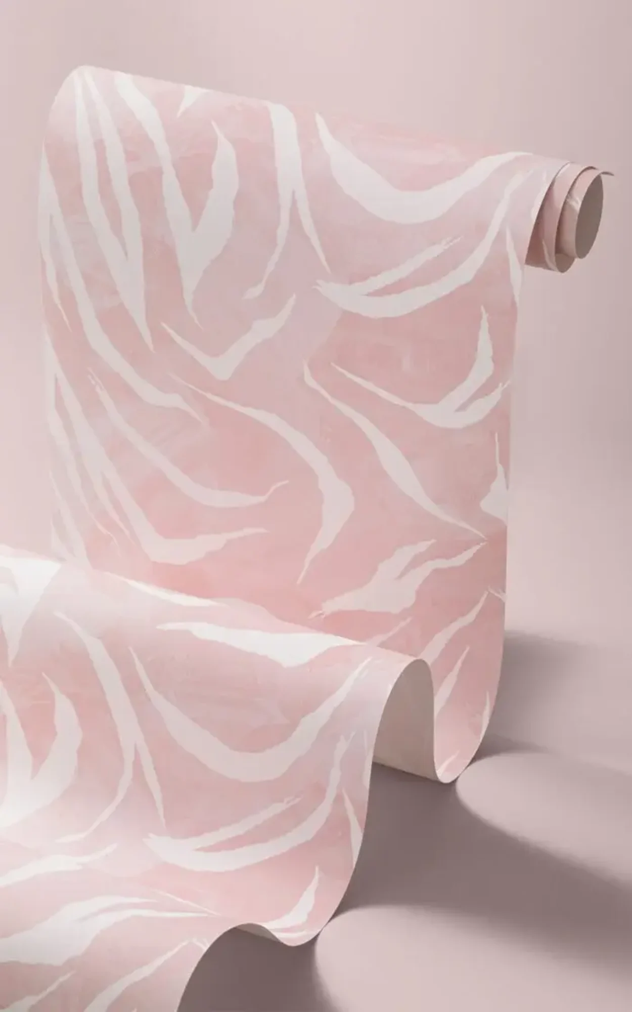 A roll of pink animal print wallpaper.