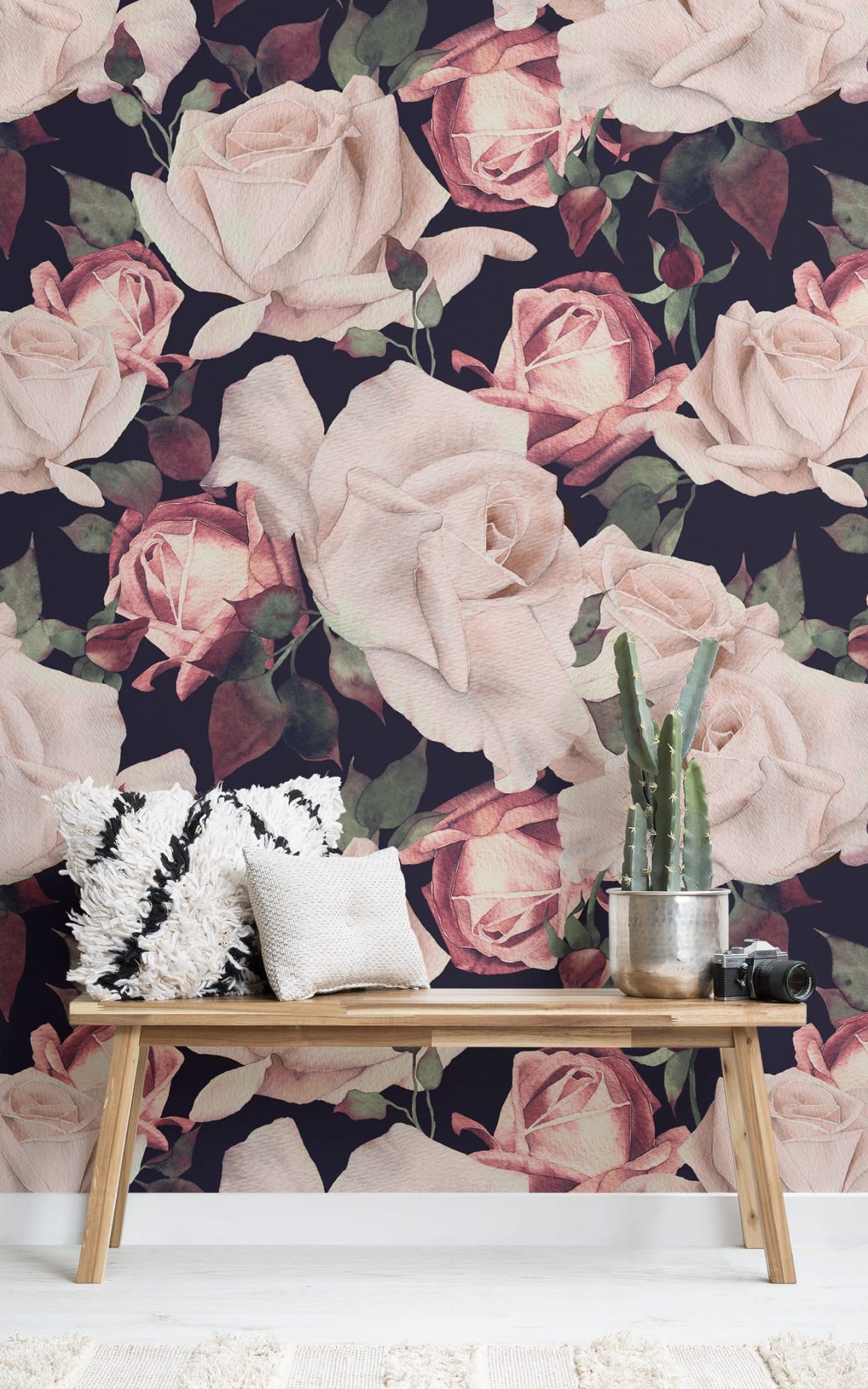  A modern interior space featuring a large, dramatic floral wallpaper with oversized pink roses on a dark background.
