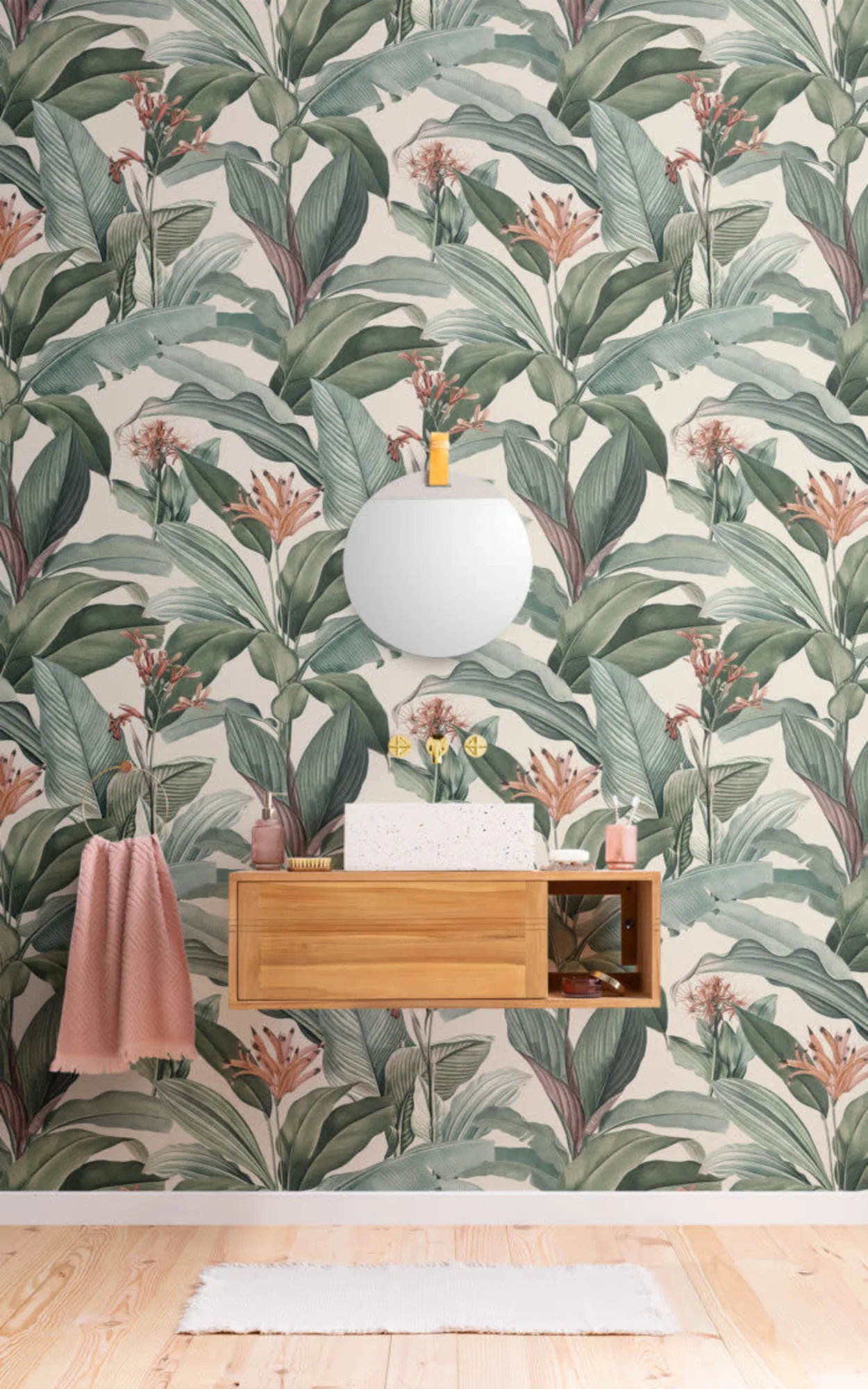 This beautifully arranged space showcases a serene bathroom setup with a large botanical-themed mural as the backdrop, featuring lush green leaves and soft pink flowers, creating a tranquil and natural environment.