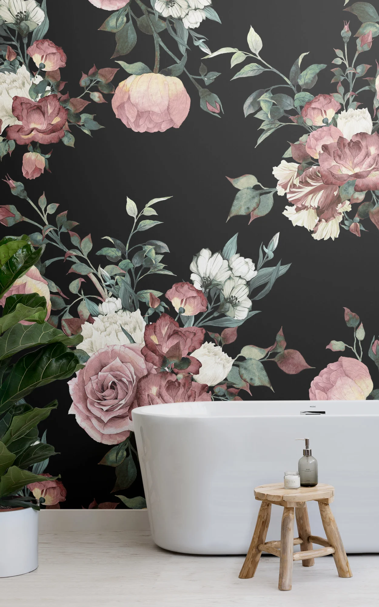 Chic bathroom with vintage pink and black floral wallpaper, freestanding tub, and rustic wooden stool.