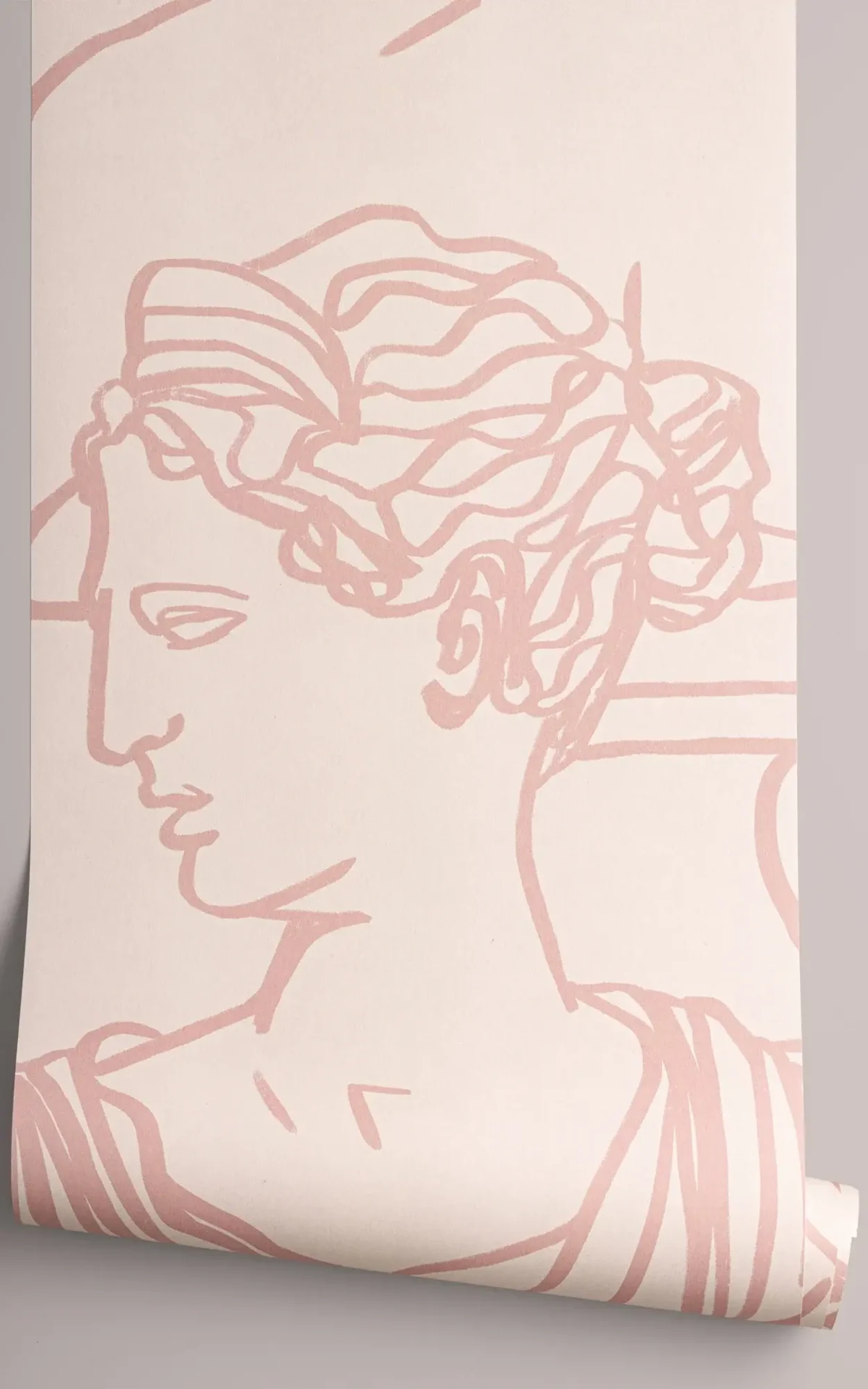 A close-up view of a blush pink wallpaper featuring a line art drawing of a classical Greco-Roman bust, giving an artistic and elegant feel to the space.