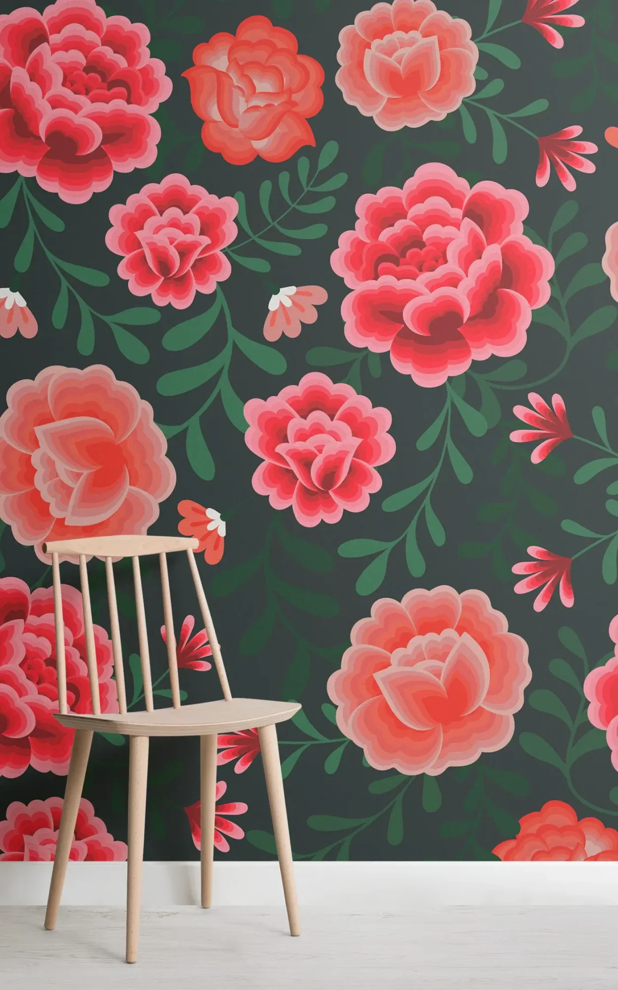 A minimalistic wooden chair against a dark green floral wallpaper featuring large, vivid red and pink roses with green leaves.