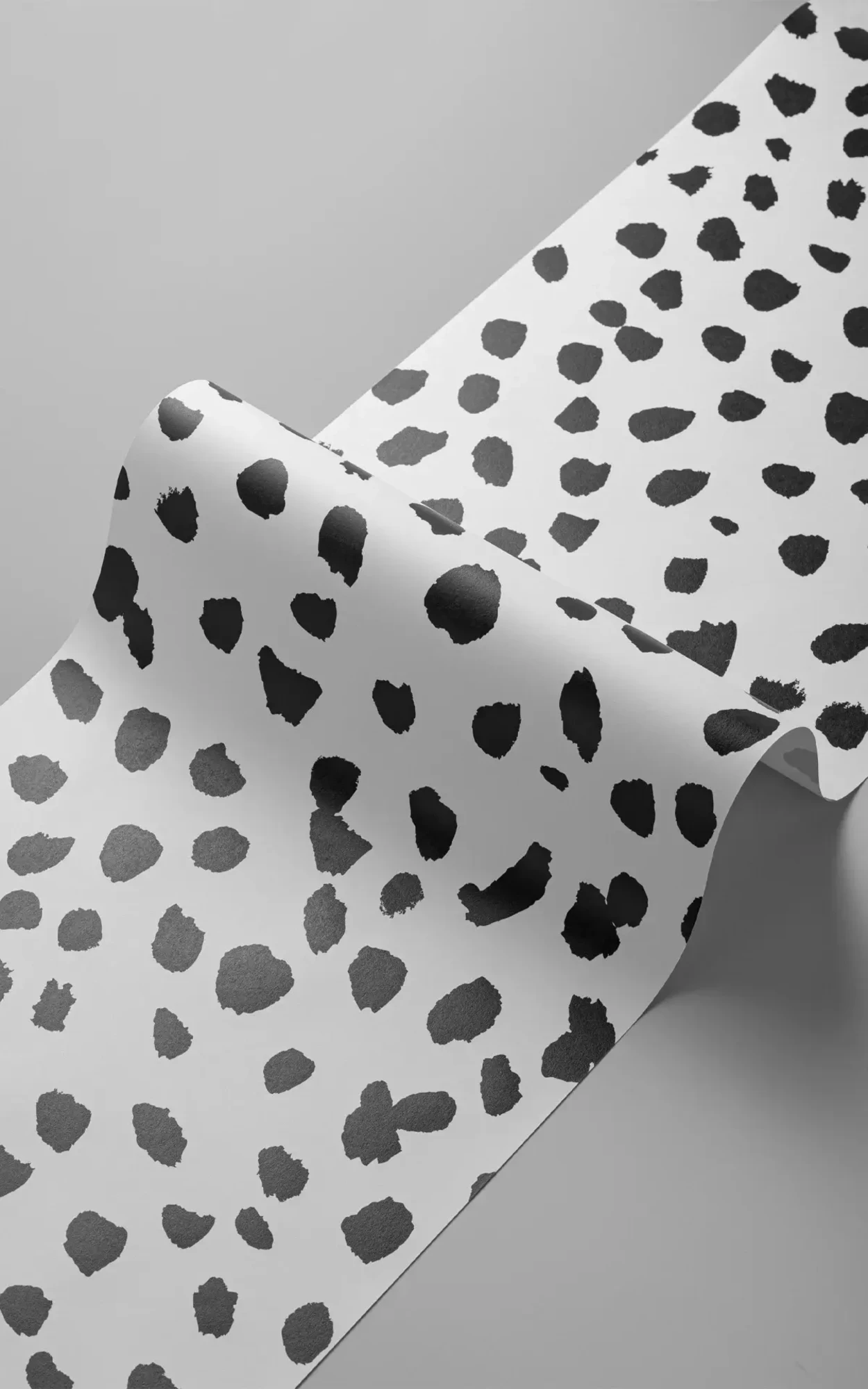 A panel of a black and white Dalmatian print mural.