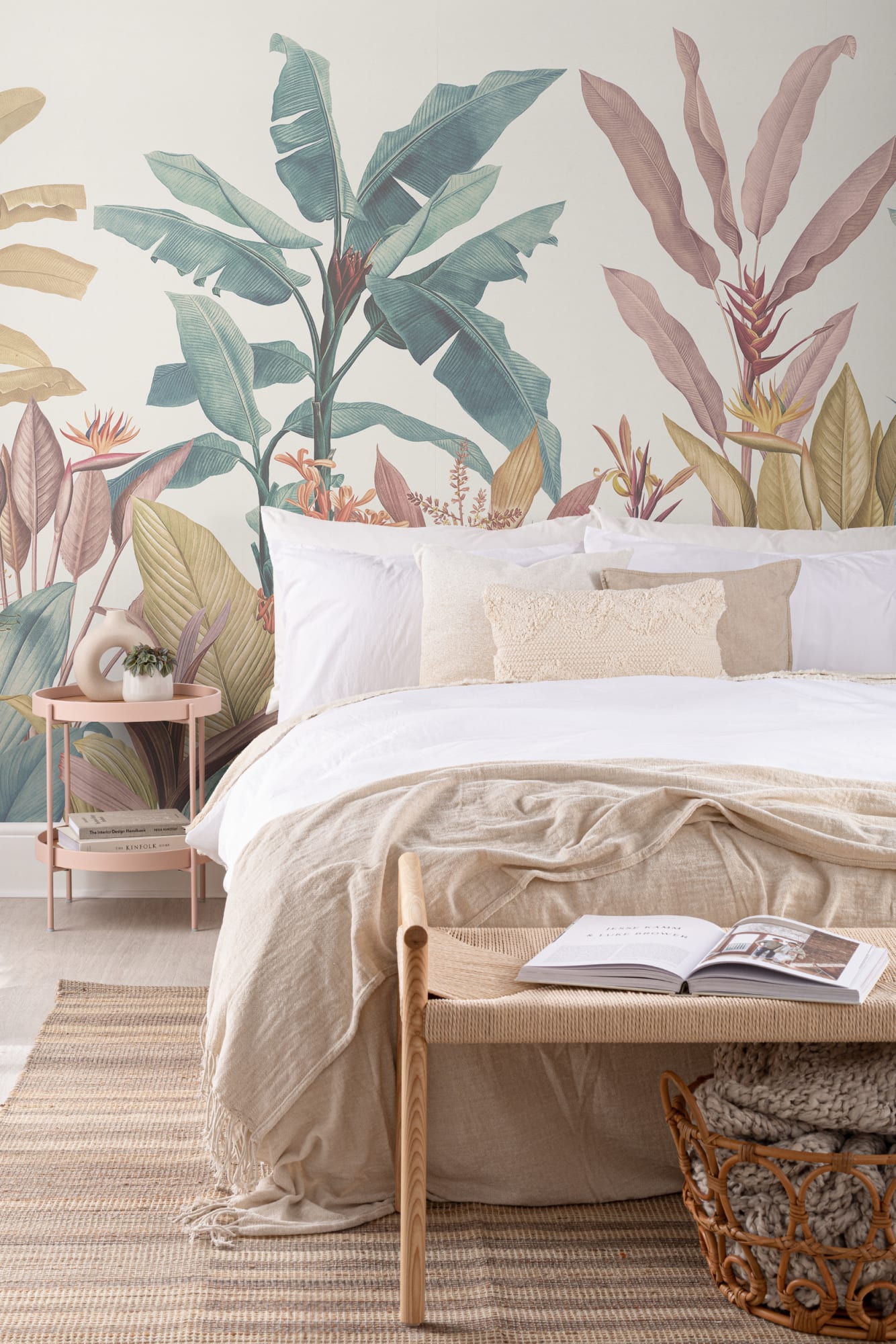A vintage-inspired bedroom with pastel palm tree mural, white bedding, and beige accents for a natural look.
