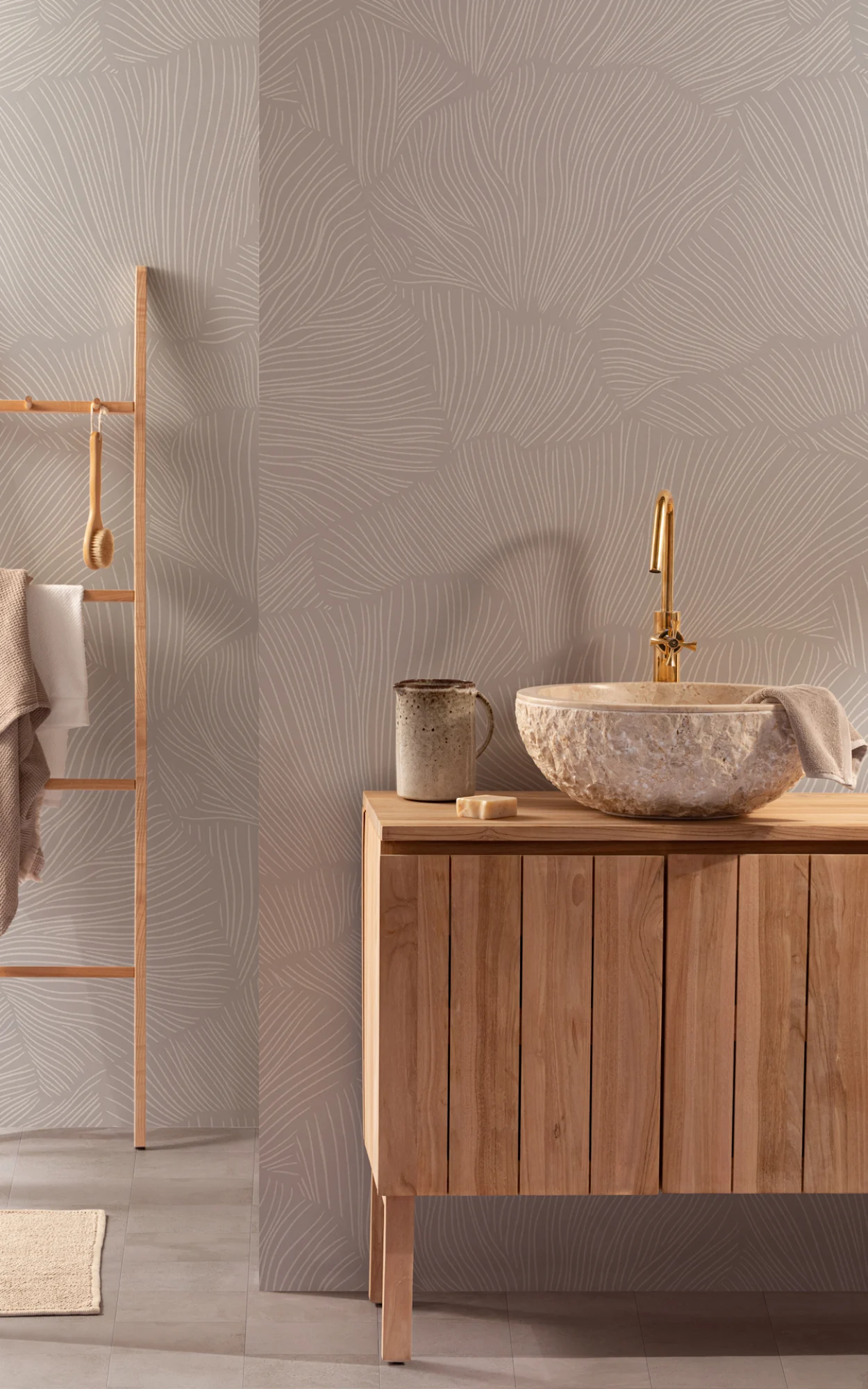 A Japandi bathroom with beige minimalist wallpaper, wood vanity, and stone sink.