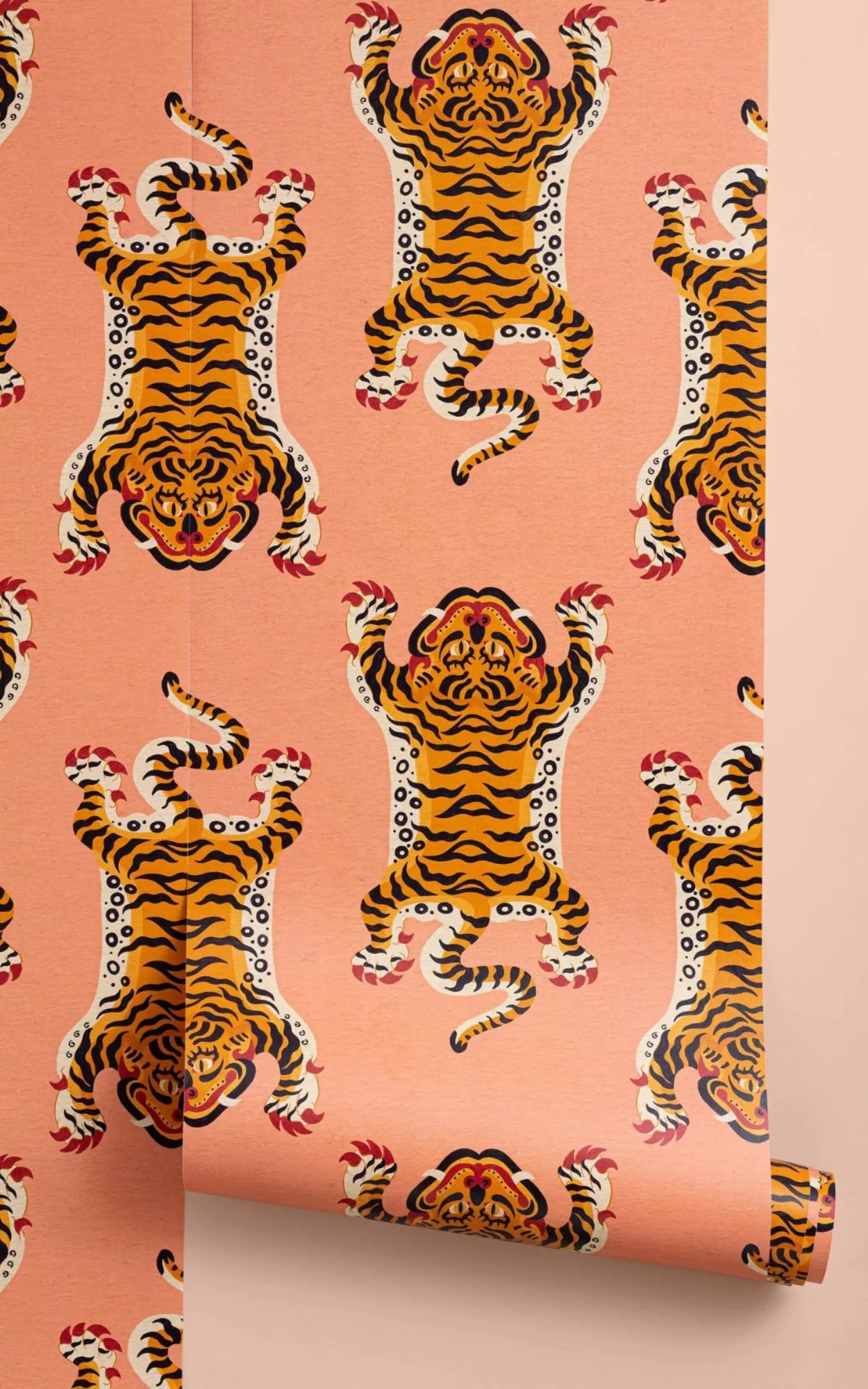 A close-up of a vibrant orange tiger wallpaper on a pink background, showcasing the intricate design and repeating pattern.