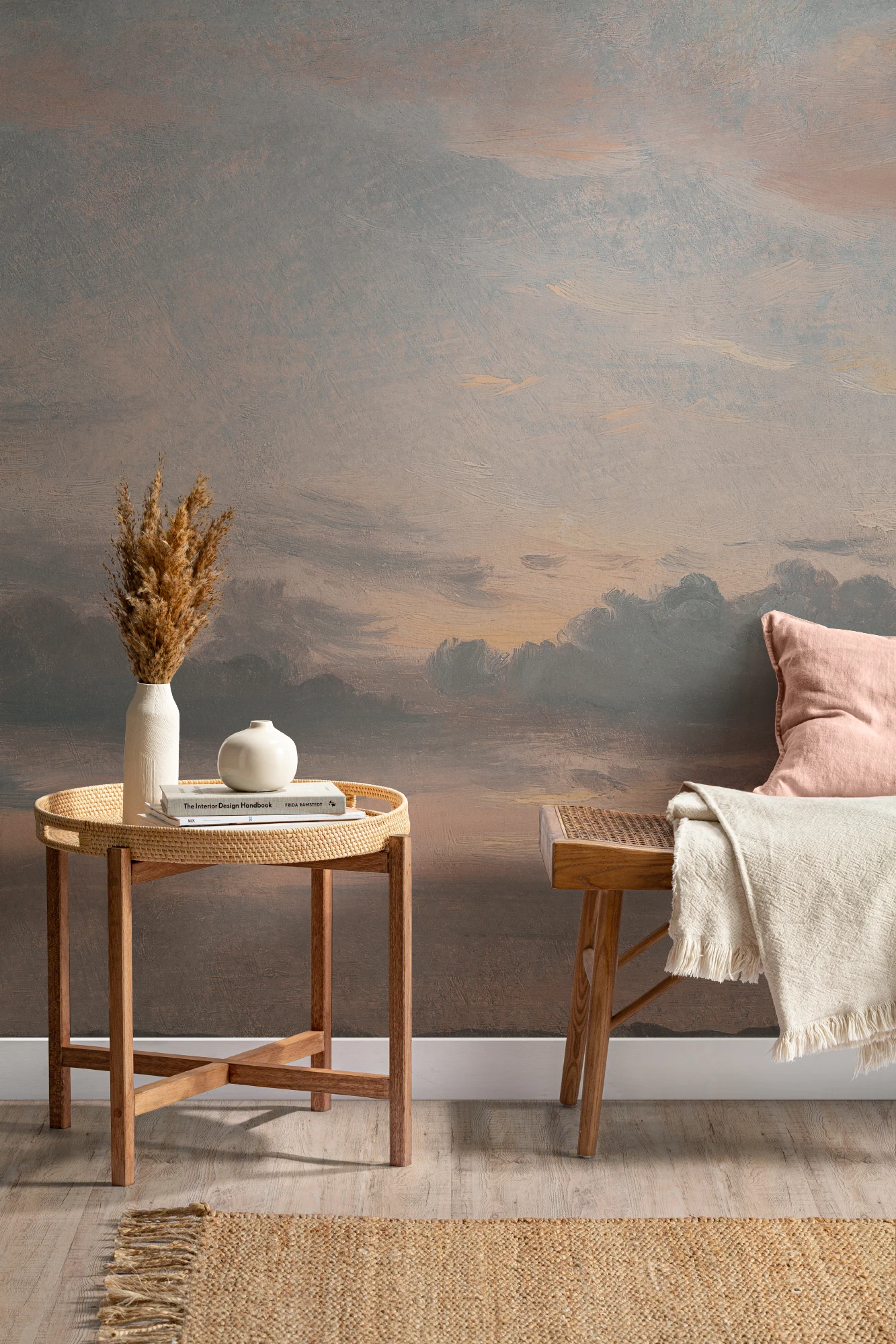 A cozy hallway with a muted sunset wall mural, natural wood furniture, and soft-toned decor.