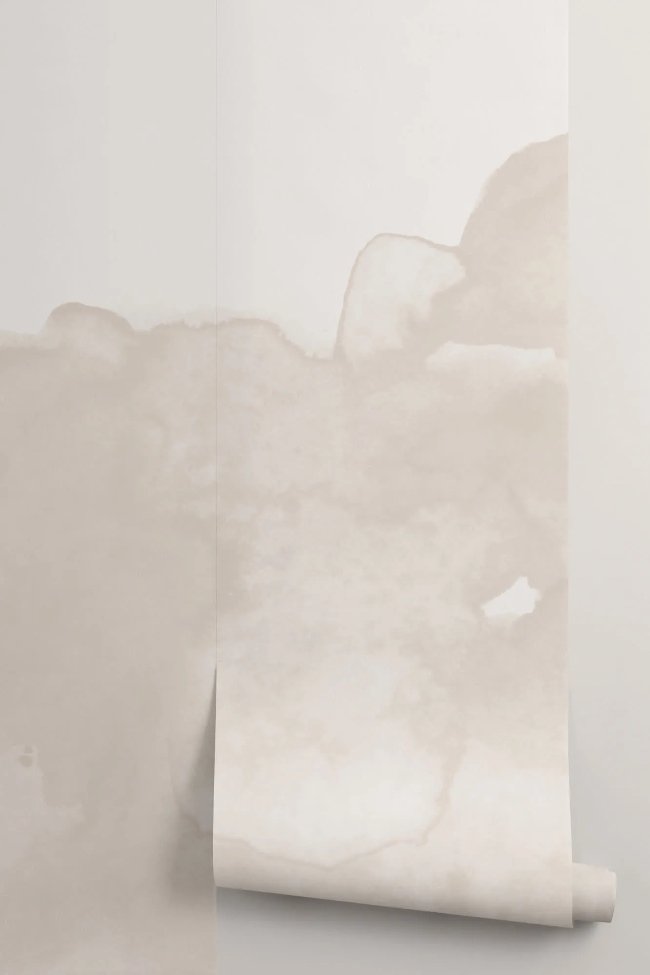 A close-up of a wallpaper roll with abstract watercolor wash in light beige tones.