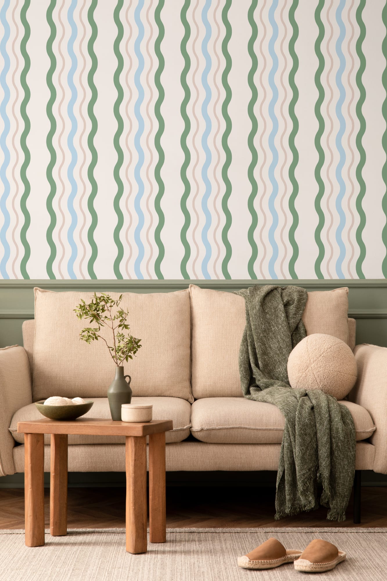Living space with wavy vertical stripe wallpaper in green, blue, and beige tones.