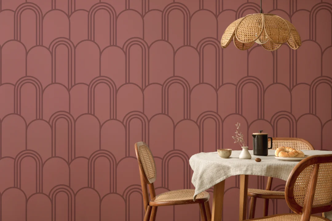 Tapet med rosa Art Deco-buemønster i gjentakende design
