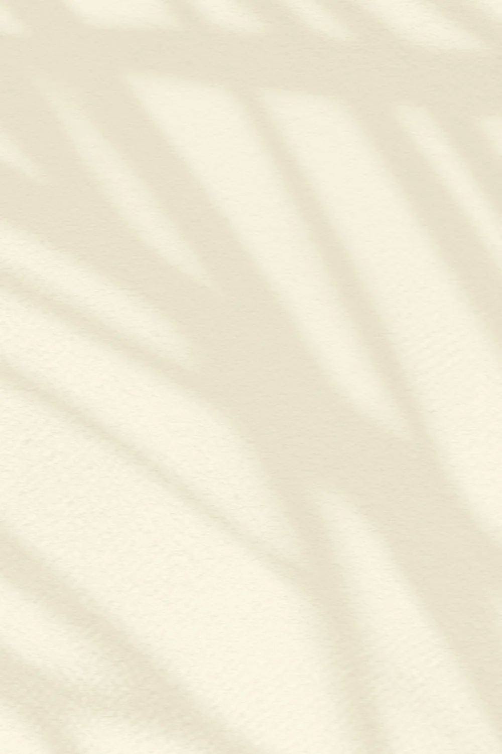 Beige fototapet med palmeblade i skyggen