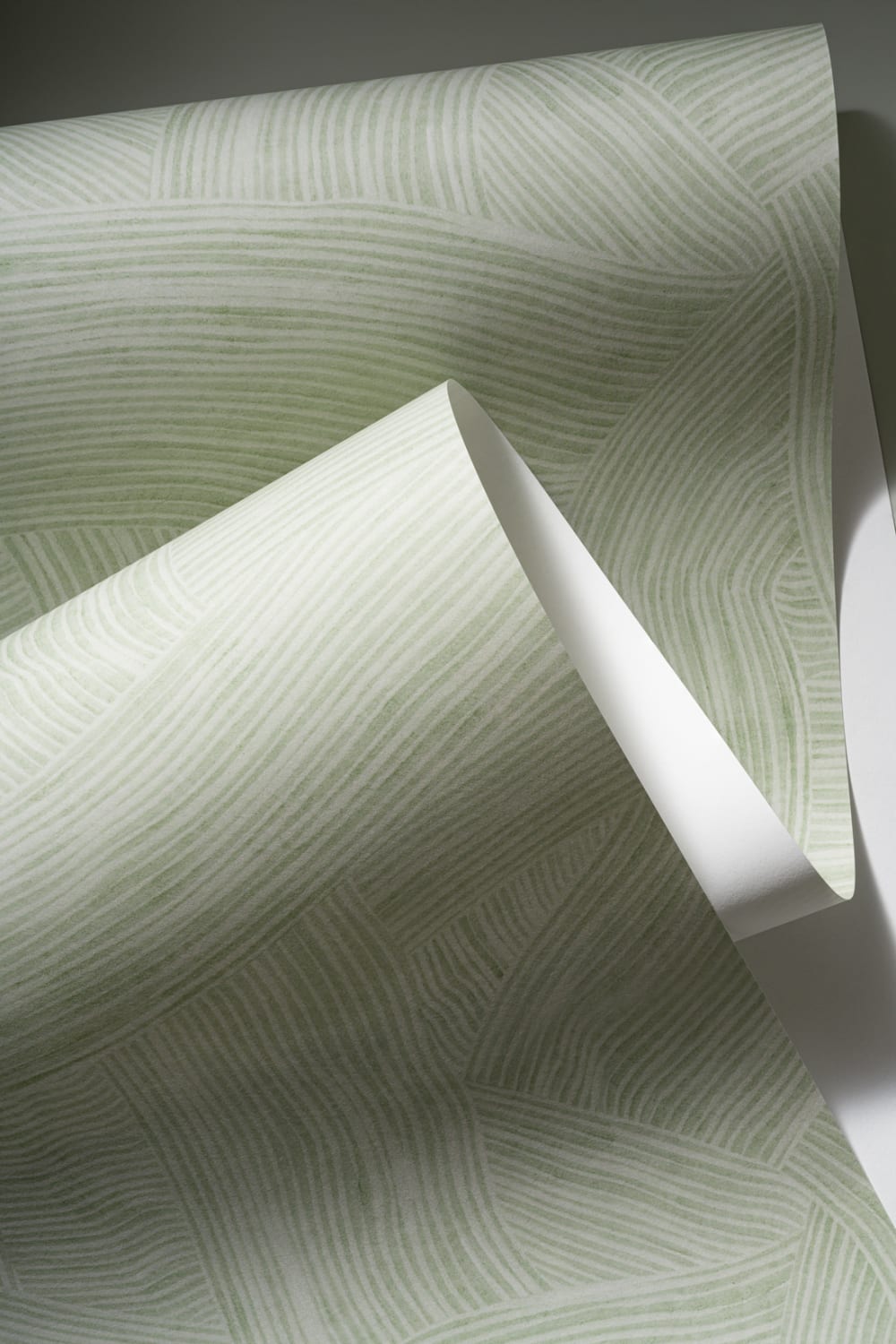 Carta da parati verde a strati con forme curve