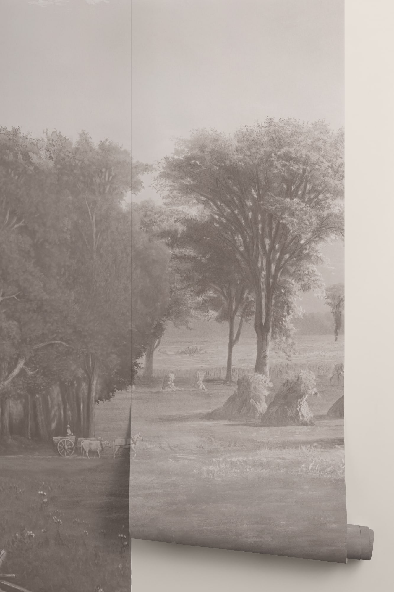 A soft gray-toned wallpaper roll displays a pastoral landscape with trees and haystacks