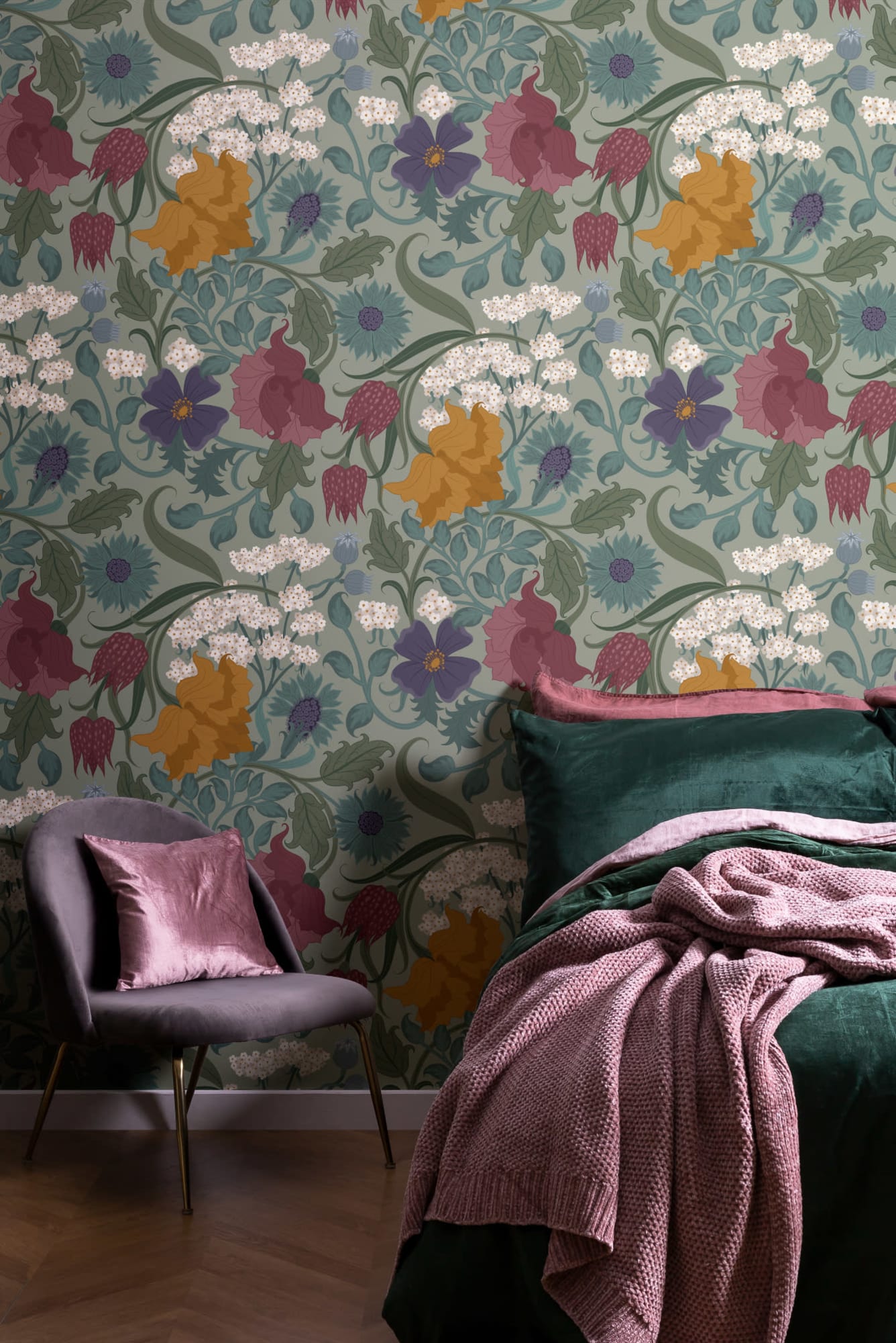 A rich-toned bedroom with a wallpaper of stylized flowers in mustard, purple, and teal.