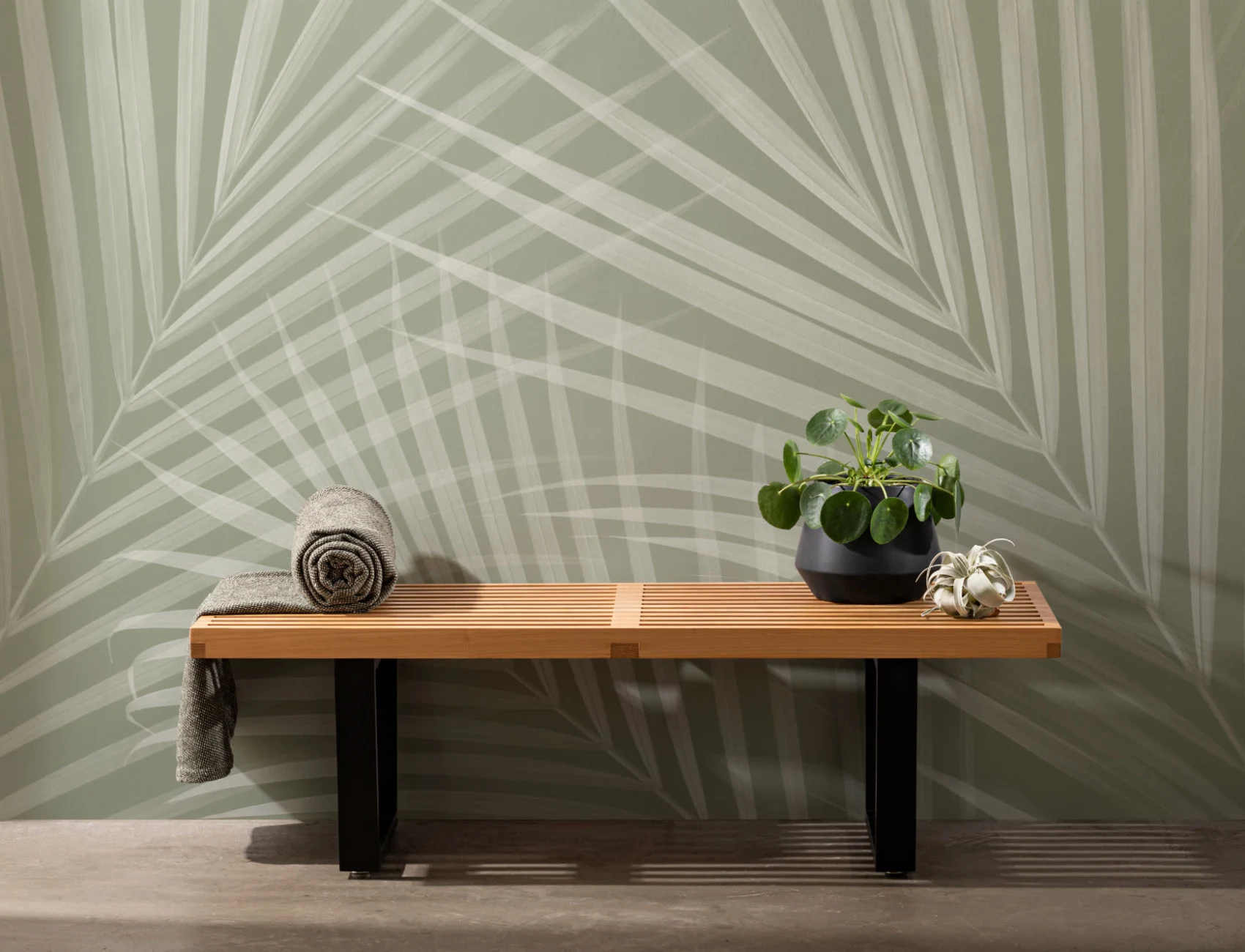Muurschildering met groene palmbladeren