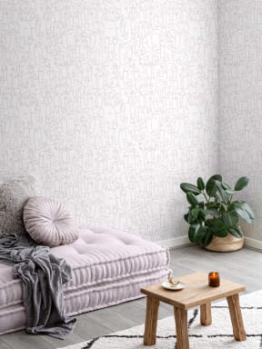 Papier Peint Rose et Blanc à Motifs de Visages Abstraits