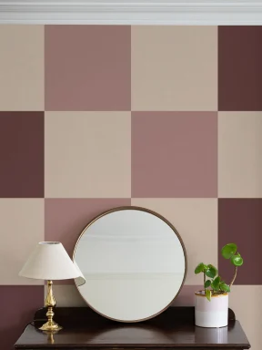 Papier peint panoramique rétro à motif damier rose pour une ambiance ludique