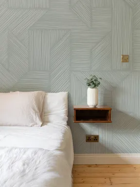 Mural de papel pintado con patrón geométrico contemporáneo en verde