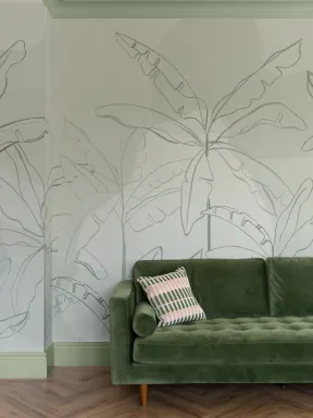Papier peint panoramique vert avec illustration de feuilles de bananier en encre