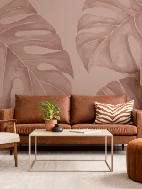 Papier peint panoramique en terre cuite avec des feuilles de monsteras