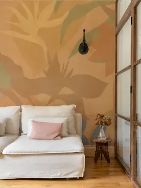 Papier peint panoramique de feuillage tropical abstrait orange