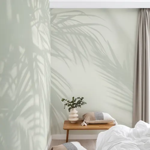 Lichtgroene palmblad schaduw muurschildering